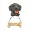 Black Lab Wearing 'Welcome' Dog Sign 